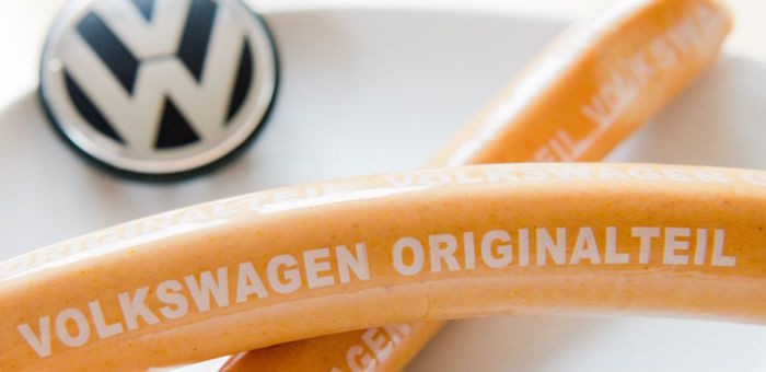 ILLUSTRATION - Curry sausages with 'Volkswagen Originalteil' (lit. 'original part') written on them lying on a kitchen table in Hanover, Germany, 19 February 2016. The curry sausage production at Volkswagen again excelled the car production in 2015. 7.2 million curry sausages were produced at Volkswagen's butcher shop in Wolfsburg in the past year. Photo by: Julian Stratenschulte/picture-alliance/dpa/AP Images